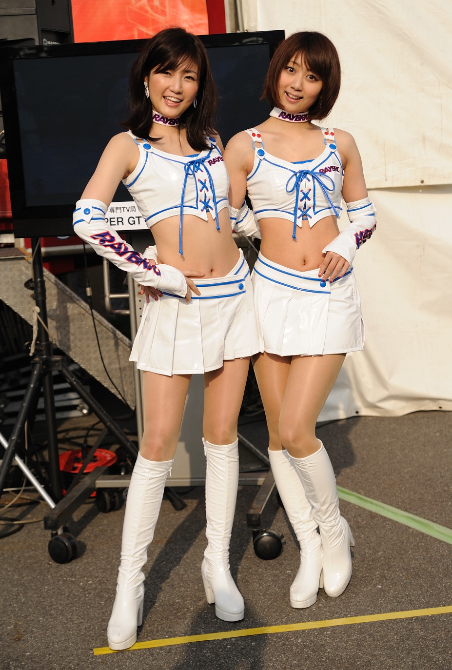 Two Race Queens wearing White Sheer Shiny Pantyhose and White Boots